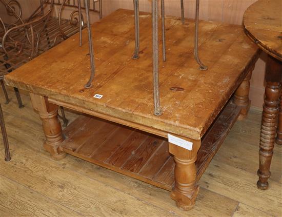 A pine square two tier coffee table W.91cm